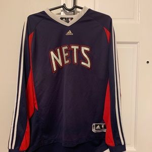 NJ nets shooting sleeve size large preowned